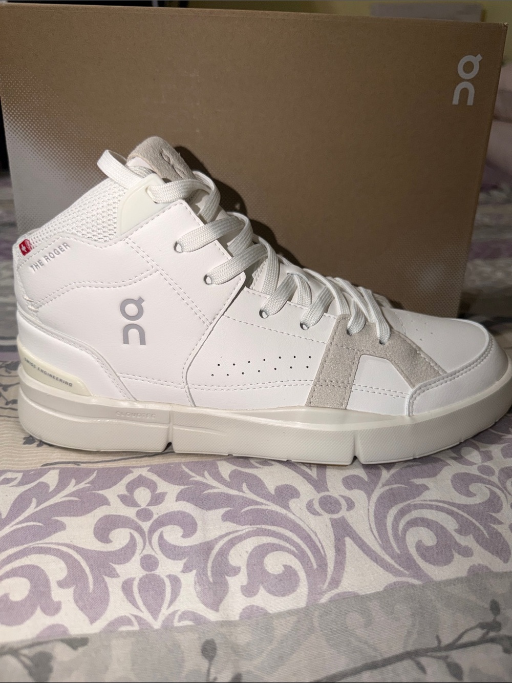 On The Roger Clubhouse Mid-Top women’s Sneaker in White and Cream